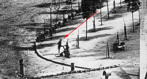 The Red Arrow is Pointing at the First Man Photographed
